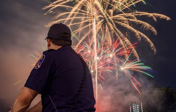 police officer watching fireworks